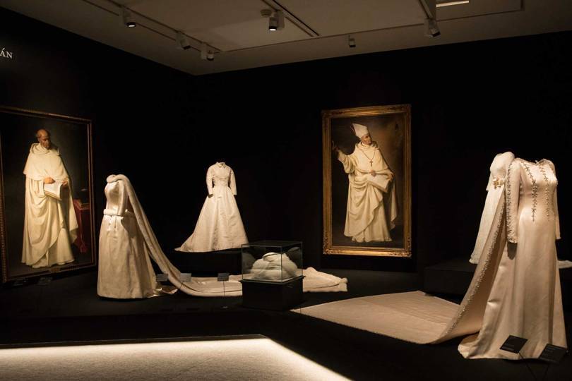Far left, a fur-trimmed wedding dress that Balenciaga made for Queen Fabiola of Belgium in 1960, set against portraits by Francisco Zurbarán (1628-34) Credit: @BORJALAMA
